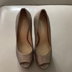 ENZO ANGIOLINI Silver peep toe platform pumps.